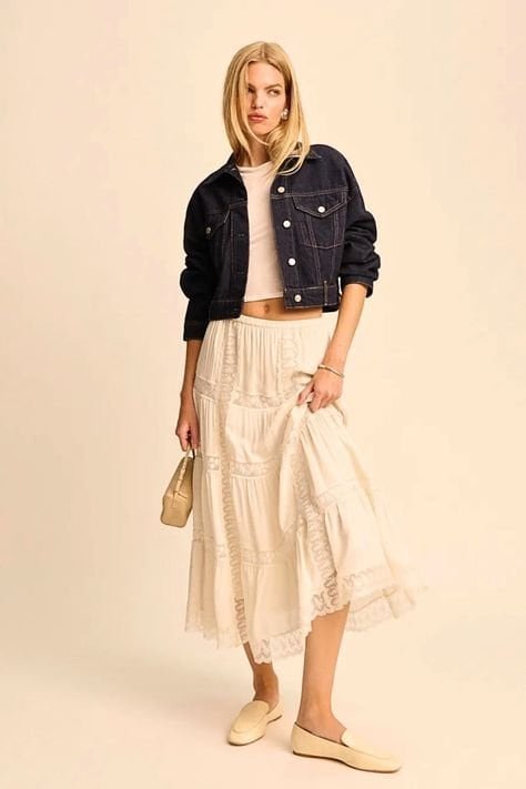 Spring outfit featuring a flowy maxi skirt paired with a denim blazer for a casual chic look.