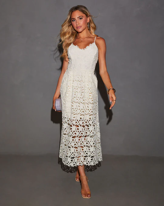 Chic white dress styled for a spring day event with a touch of western flair.