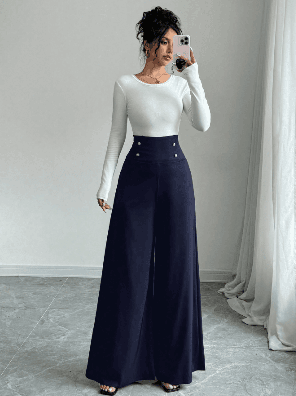 Woman wearing high-waisted pants that elongate the legs and balance the pear-shaped body.