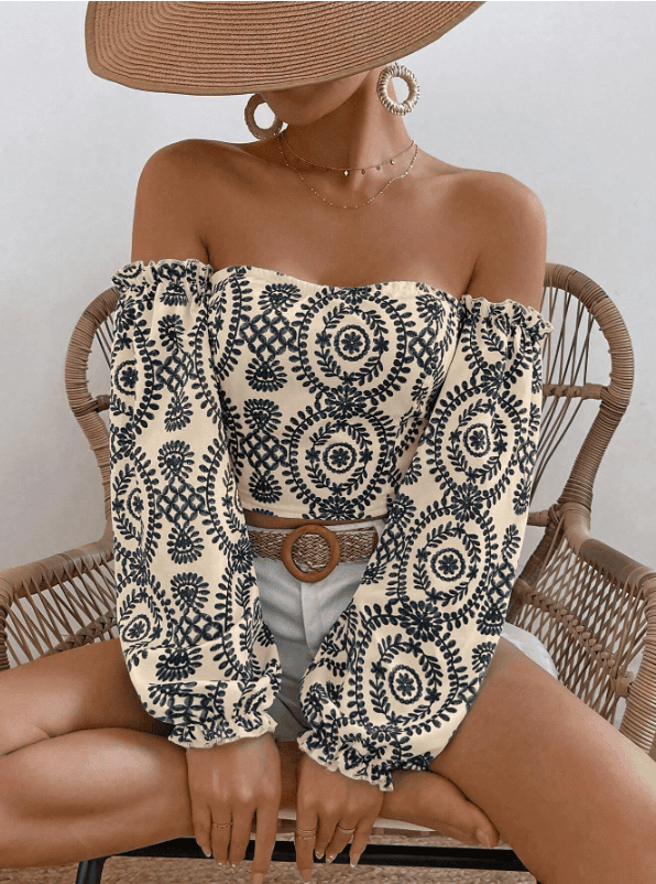 Woman wearing an off-shoulder summer top that highlights the shoulders.