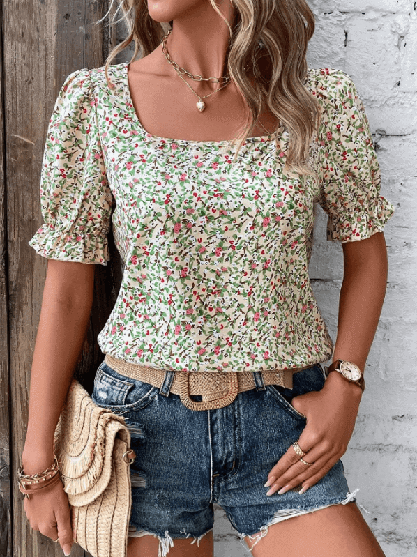 Woman wearing a summer top with flouncy balloon sleeves, styled for pear-shaped body.
