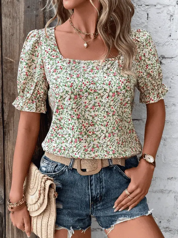 Woman wearing a floral print top styled for summer 2025 fashion trend